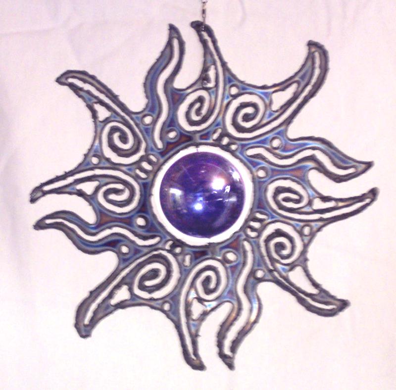 stainless steel sun burst with blue spinning glass marble